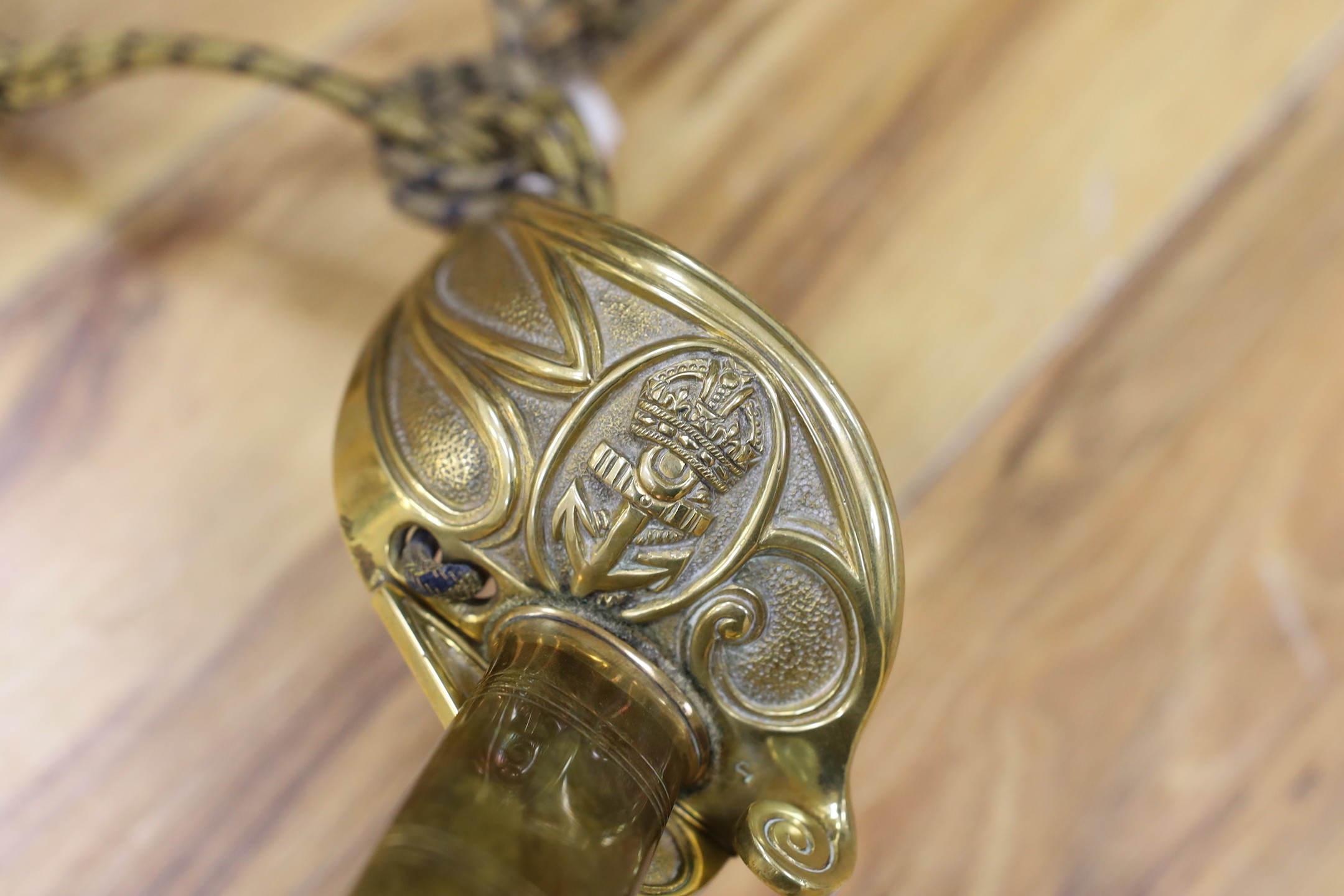 A George V naval officers sword, made by Friedeberg Portsea, serial number 4351 stamped to spine